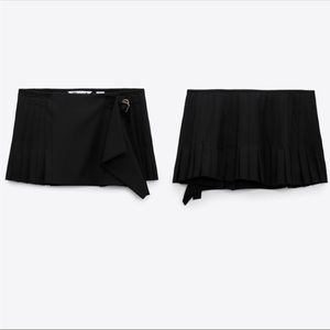 Zara black pleated mini skirt with gold hardware. NWT.